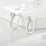 Load image into Gallery viewer, Close-up view of moissanite hoop earrings in silver from a different angle