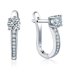 Sparkling moissanite hoop earrings in silver on a white background
