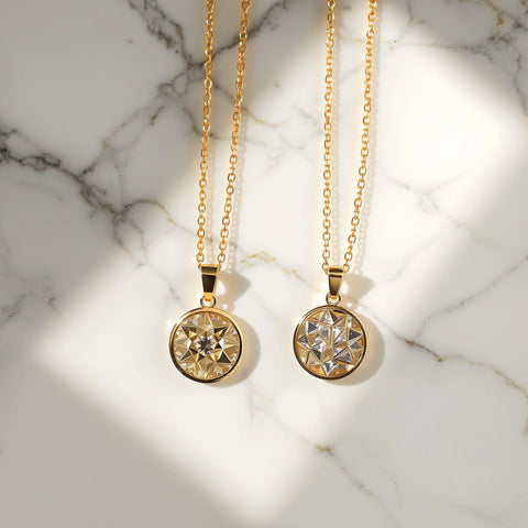 10K vs 14K gold jewelry comparison — pendants on white marble