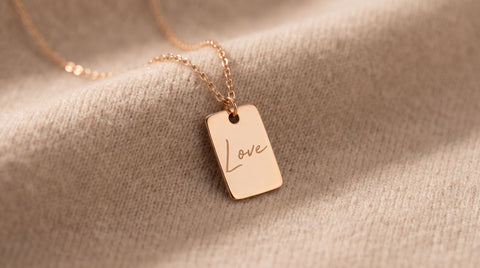 Rectangular gold tag pendant styled for an affirmation jewelry guide