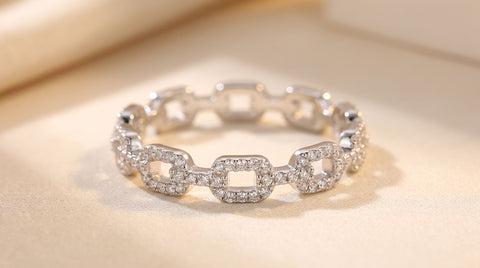 Sterling silver hip-hop chain ring with 18K gold plating and pave CZ stones, close-up product photo