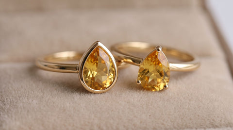 Citrine gemstone rings in bezel and solitaire settings on warm gold bands