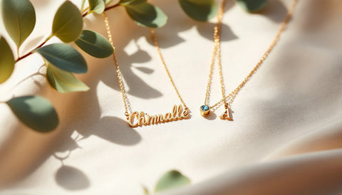 Personalized gold-plated sterling silver name necklace and birthstone ring for mom laid out on linen