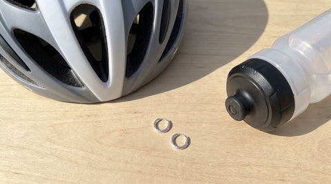 Silver huggie earrings styled as a cyclist gift