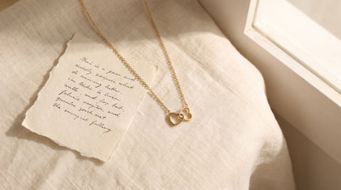 Gold double heart pendant necklace as an empty nester gift