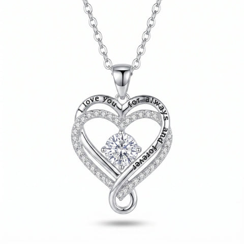 Silver-tone engraved heart necklace on a white background, with the engraved phrase running along the pendant's rim