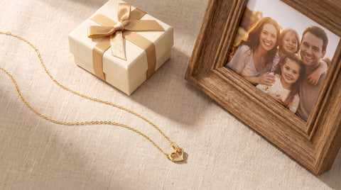 Gold heart necklace styled as a gift for the bride's parents