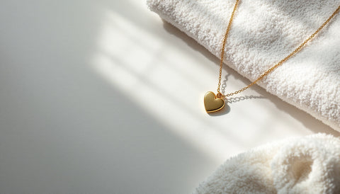 Small dainty gold heart necklace styled as a dog groomer gift