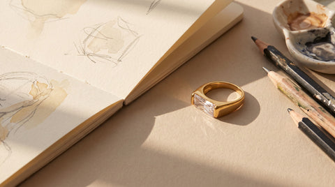 Gold statement ring styled as a tattoo artist gift