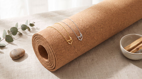 Small dainty gold heart necklace styled as a yoga instructor gift