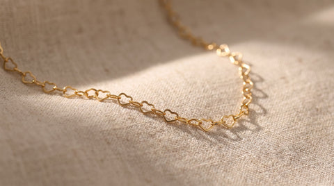 Close-up of a gold jewelry chain showing its metallic finish