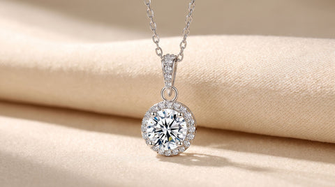 Rhodium-plated stainless steel halo pendant necklace with a CZ center stone, close-up product photo