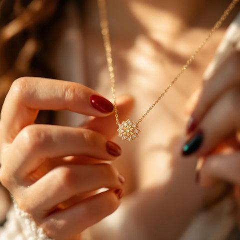Woman holding gold vermeil pendant necklace close-up