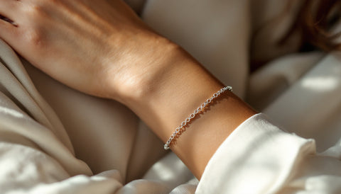 Close-up of a hypoallergenic sterling silver bracelet on a wrist