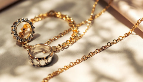 Silver and gold-toned jewelry pieces arranged together showing different metal finishes