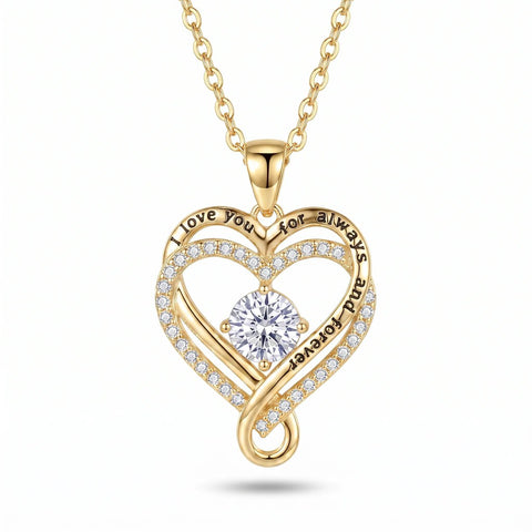 Gold-tone love knot heart necklace on a white background, showing the twisted knot loop below the heart's point