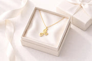 Personalized gold heart initial necklace for mom on white marble surface, 18K gold plated