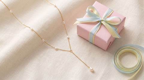 Gold freshwater pearl necklace styled as a pregnancy congratulations gift