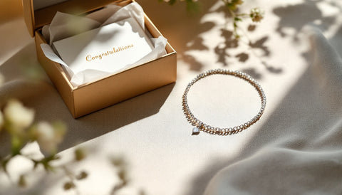 Sterling silver necklace, bracelet, and earrings arranged as a promotion gift beside an open gift box