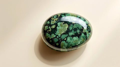 Polished green serpentine gemstone specimen with mottled snakeskin-like pattern