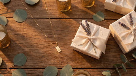 Gold initial tag necklace styled as a wedding guest thank-you favor