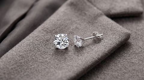 Small sterling silver stud earrings appropriate for a court appearance
