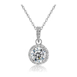 Load image into Gallery viewer, Round Halo Pendant Necklace — 1 carat cubic zirconia center stone, pave CZ halo, 316L stainless steel, rhodium plated, white background
