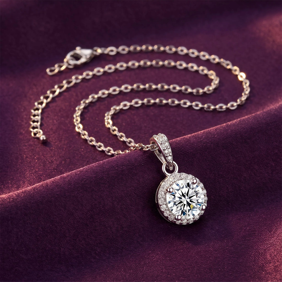 Round Halo Pendant Necklace coiled on purple satin, editorial lifestyle photo