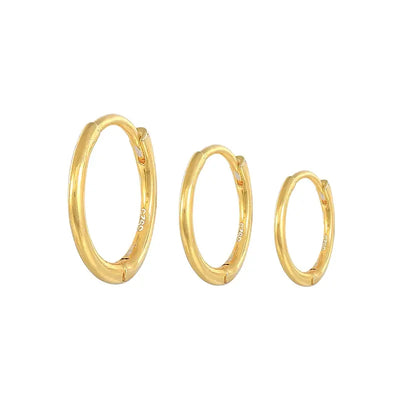 Thin sterling silver huggie earrings in 18K gold plating