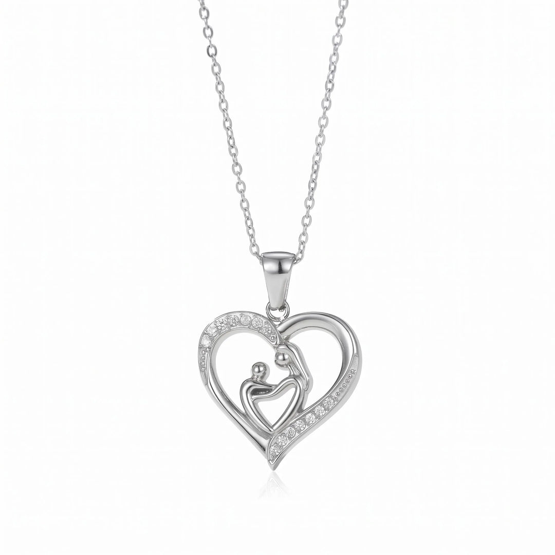Mom Heart Necklace in silver-tone stainless steel, mother and child heart pendant with CZ pave stones, white background