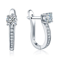 Sparkling moissanite hoop earrings in silver on a white background