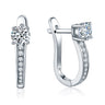 Sparkling moissanite hoop earrings in silver on a white background