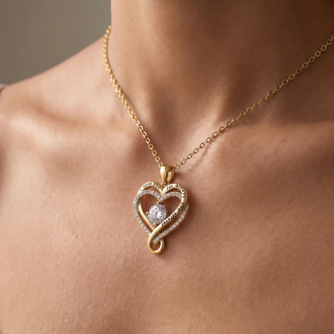 Love Knot Heart Necklace worn at the collarbone, 18K gold-tone finish