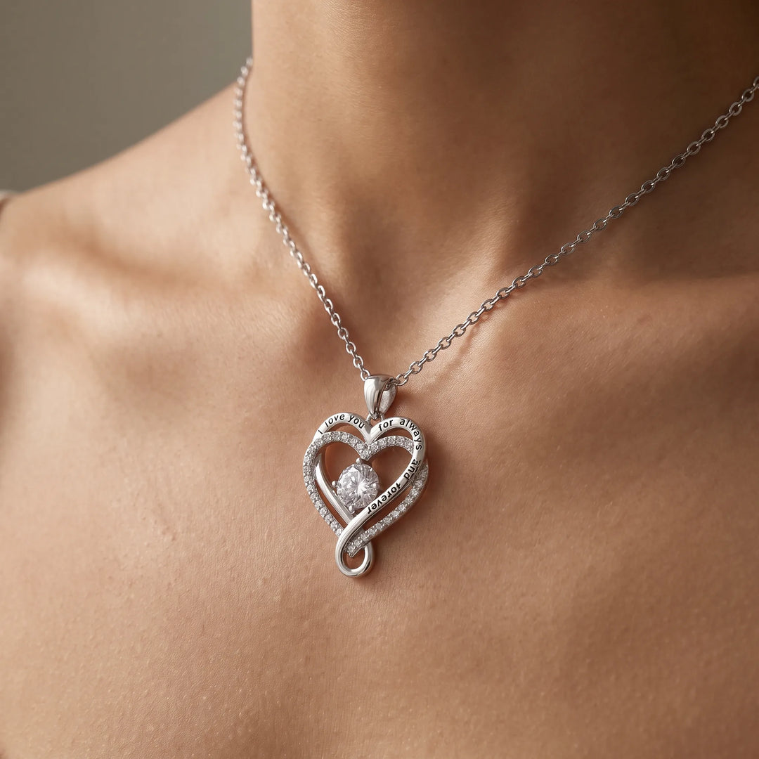 Love Knot Heart Necklace worn at the collarbone, silver-tone finish