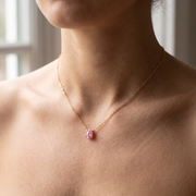 Pink tourmaline teardrop pendant necklace worn at the collarbone in natural daylight — 18K gold plated 925 sterling silver