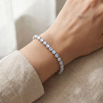 Lade Bild in die Galerieansicht, Rainbow Moonstone Tennis Bracelet worn on the wrist
